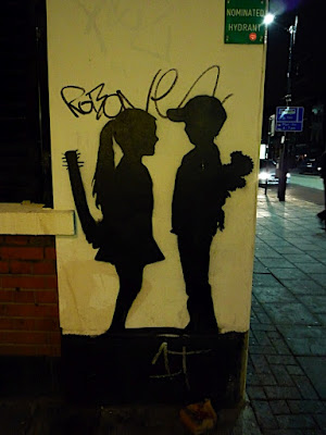 two children, one holding a club