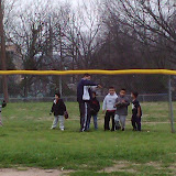 Coach instructing the little guys