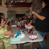 My dear friend, Laura, came by to give us some tips on making mums.  Last year, she had to make 16 mums!