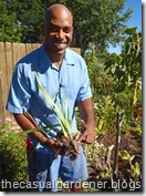 William Moss at Shawna Coronado's garden digging up plants.      