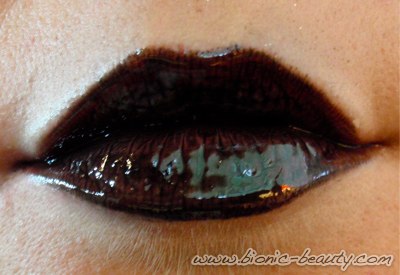 The black lip makeup look using Wet n Wild black lipstick and Sally Hansen lip gloss