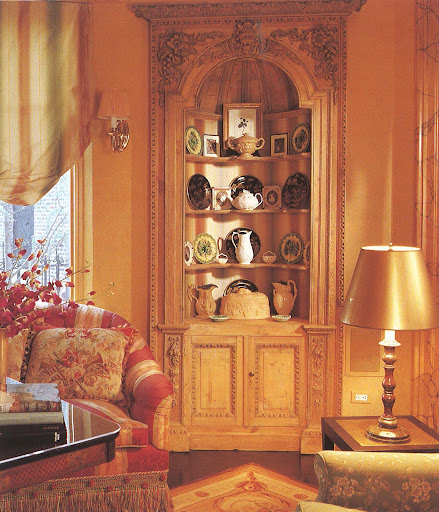 A stunning built-in cabinet holds a fine collection of porcelain and clay.