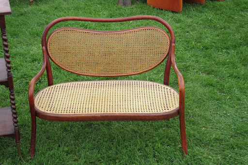 This wicker bench was miniature -- just the right size for a little girl's room.