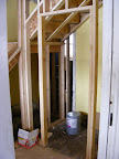 The framing for the front coat closet
