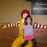 Madeline poses with the Ronald McDonald statue near the Childrens Museum