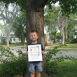 Erik says cheese with his sign (too bad I didnt take another picture, since he closed his eyes for this one!)
