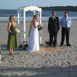 Lew and Cheryl, getting married on a piece of plywood in the sand