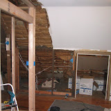 I'm about halfway through tearing out the old wallboard in this picture - the boards were actually wood fiberboard, which is a real fire hazard