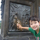 Kai at the statue of St John Nepomuk on the Charles Bridge