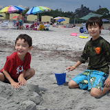 Eidan and Kai making a sand castle Eidan and Kai making a sand castle