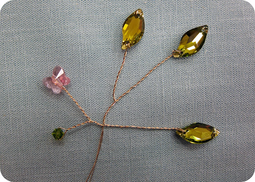 Try not to create too much space between each random bead. Add a cute butterfly shaped crystal!