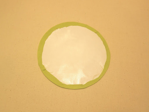 A completed circle will look like this - not perfect from this side, but all fabric has been secured to the edges in smooth curves.