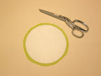 Trim fabric, leaving about 3/8 inch all the way around circle (this does not have to be perfect).