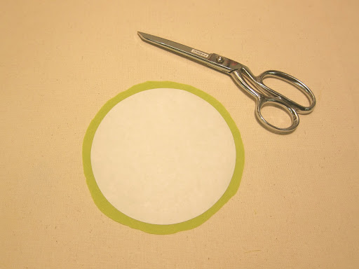 Trim fabric, leaving about 3/8 inch all the way around circle (this does not have to be perfect).