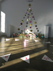 Metallic wrapped packages under a string-light tree from December's Outdoor Lighting story. The numbered triangles were used for the Craft Walk.