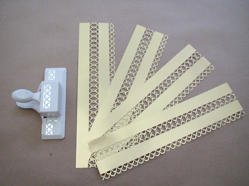 Here, all four strips have been punched along the edge and along the scored fold as described in the previous slide.