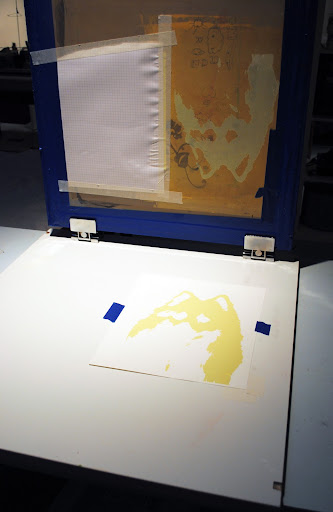 Lifting the screen to reveal the print. Lifting the screen to reveal the print.