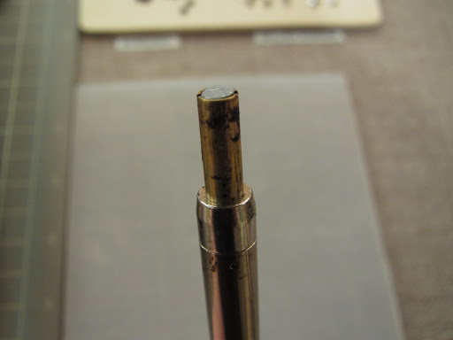 when the rhinestone is in the Hotfix tool, the flat back should be facing up