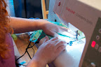 Sew straight lines across the fold to form each small pocket. This is a great time to use decorative stitches! Sew straight lines across the fold to form each small pocket. This is a great time to use decorative stitches!