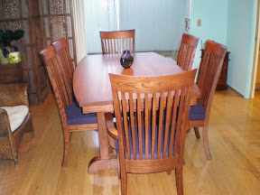 70 x 42 Western Dining Table, Curved Tabletop, Custom Lancaster Chairs with Fabric Seats, Mahogany oak