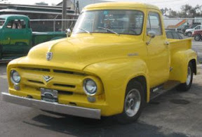 Nice yellow slant cab running a 1956 grill.