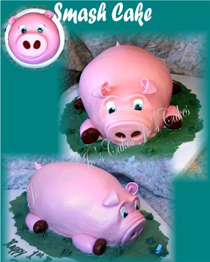 Large pig cake with small pig face smash cake. Large pig cake with small pig face smash cake.