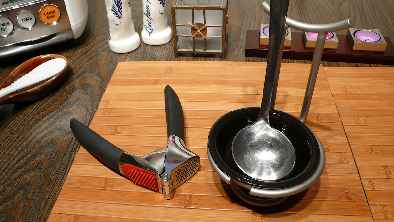 garlic press and spoon rest