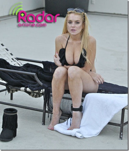 Lindsay spent the afternoon with sister Ali and a friend by a pool in Hollywood CA_ Lindsay looked very relaxed sunbathing and reading what looked like to be a script to her sister and friend_ Lindsay chose to hide away from the media as it was said today that her Scram bracelet indicated that she had drank alcohol at an after party for the MTV movie awards last Sunday.AKM Images  06_08_10   Premium Exclusive_   Internet CALL for fee.Alex 310 3478241.alex_akmimages.net