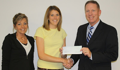 4-H/Youth Coordinator, Kati Peiffer &amp; fundraising committee member, Carol Horning, accept a $500 donation from Steve Olson, President &amp;CEO of West Chester Savings Bank.  This donation goes towards the new multi-species building being built on the Washington County Fairgrounds, for the 2010 Fair.  This building is possible by generous donations like ones from the West Chester Savings Bank, Riverboat Foundation Grant and support of the county in fundraising efforts.  Additional funds are still needed to complete the building.  To make a donation contact the Washington County Extension Office, 319/653-4811. (Courtesy Photo)