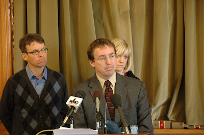 Photo Caption: Tom Chapman, the executive director of the Iowa Catholic Conference, joined legislative advocates of payday loan reform at a news conference at the Iowa Statehouse January 5. The organization, which represents Iowa’s Catholics, strongly urges the Legislature to limit the interest rate on payday loans to 36 percent.  Military families already enjoy this protection thanks to Congressional action in 2007. Pictured from left, State Senator Joe Bolkcom of Iowa City, Chapman, and State Representative Janet Petersen of Des Moines. (Photo Courtesy of Iowa Senate