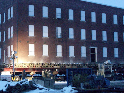 Crews at the old Mills Seed Building set up lights so they can work after dark (2/22/10) KCII NEWS