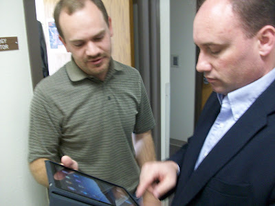 WCSD Technology Director Jeff Brock (Left) shows WHS Principal Shane Ehresman a few things on the iPad (KCII NEWS)