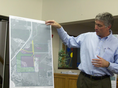 Scott Renaud of Fox Engineering points out the likely path of the new sewer line (KCII NEWS)