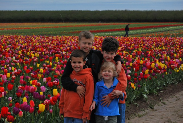 [happy kids in front of tulips[2].jpg]