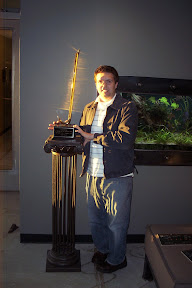 Me holding the golden crowbar. The light coming in from the huge window in the Valve lobby was just a coincidence; I didn't edit this at all. I look really weird because I've just been locked in a room with Half-Life 2 for 3 hours, wandered the halls of Valve Software for another 2 hours talking to Programmers and Artists, and all I had had to eat was four Starbucks Frappuccinos and a hot pocket.
