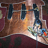 The Pickguard is done!  All soldered and ready to be screwed onto the guitar.