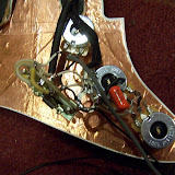 A closeup of the wiring.  I used a Sprague Orange Drop .022 tonecap.  I have several different tonecaps, and may make some mods later.  You can also see the star ground here, which I covered up with electrical tape later.
