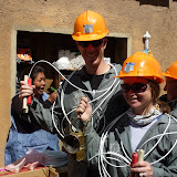 Gingerly holding up our purchased sticks of dynamite