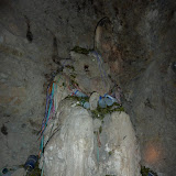 The Tio surrounded by offerings of coca leaves, tobacco and alcohol.