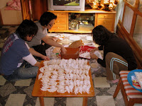 My wife and two brothers-in-law making holiday dumplings My wife and two brothers-in-law making holiday dumplings