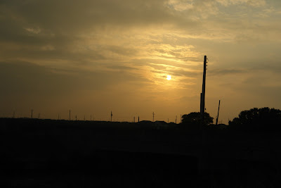 Looking west on Route 61. Sunset on the Taiwan Strait in a hour.