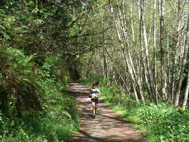 Serena running thrugh lush environs