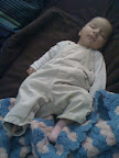 Here's a picture of Audrey sleeping on the floor. She has these cute overalls that she wears really well.
