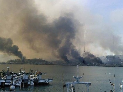 [photos smoke billows from houses on Yeonpyeong island after the North Korean artillery barrage 2010[7].jpg]