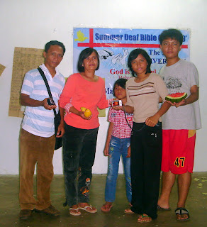 Day 4 - Cortez Family led by Ptr. Mamerto Cortez Jr. (left) proudly showing the Panasonic Lumix Digital Camera which they won as top prize during the raffle draw courtesy of Korean Deaf Missions.