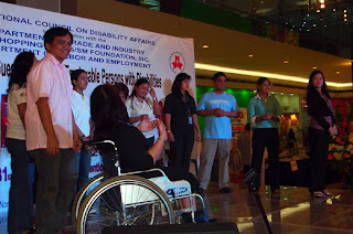 Ma'am Nelia De Jesus (right) leads the sign language interpretation of Willie Revillame's famous song.