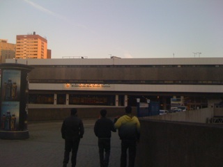 a group of people walking in a parking lot