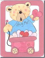 teddy bear with wagon full of valentine's hearts
