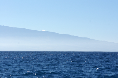 Kona Coast from the Kohala Coast. Ocean meets sky via vog Ocean blue and sky blue meet via vog (volcanic fog)