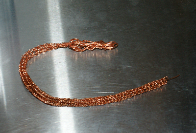 Hand knit copper wire bracelet in progress by Sherry Cordova
